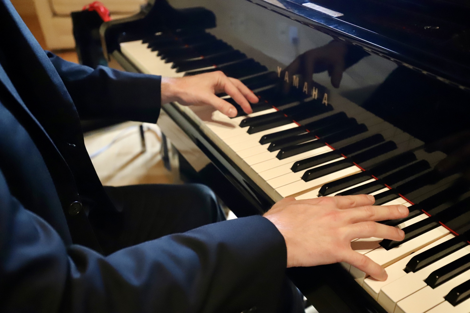 Connor O’Kane’s hands at the piano